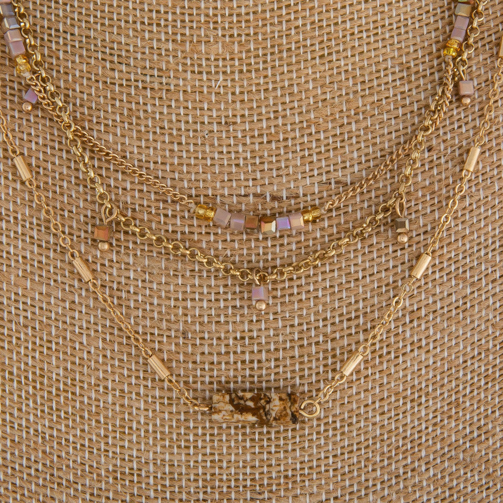 Long multi layered necklace with beads and natural stone pendant. Approximate 18" in length
