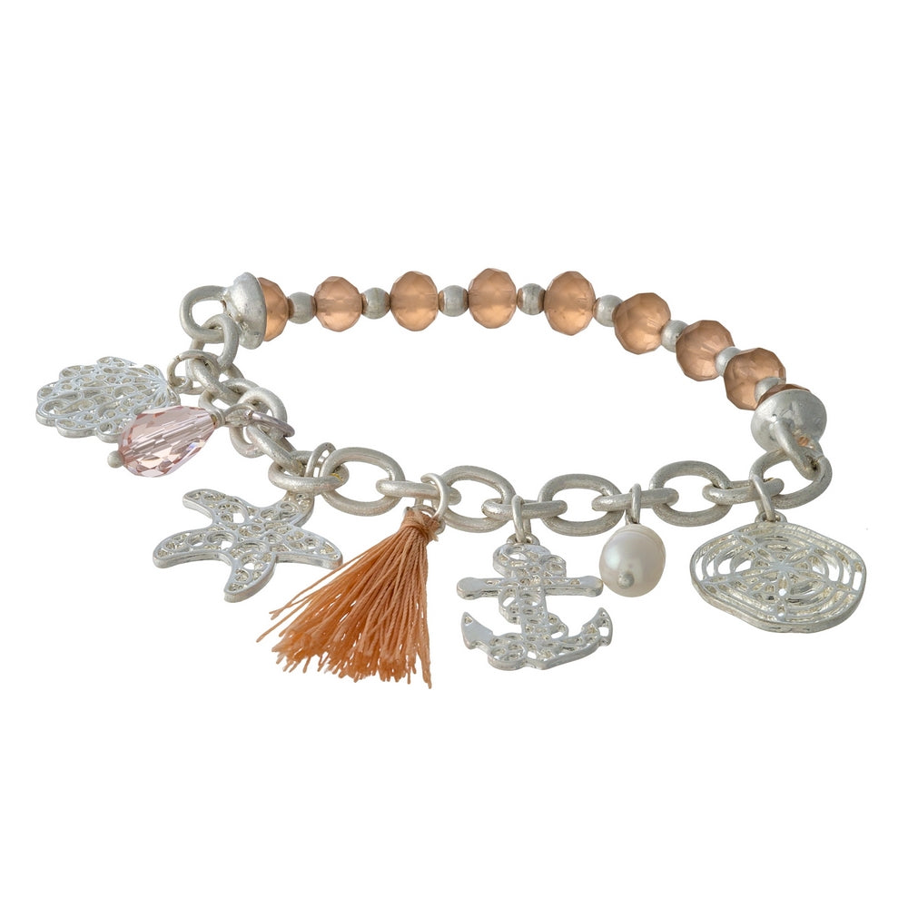 Silver tone and peach beaded stretch bracelet displaying sealife and tassel charms