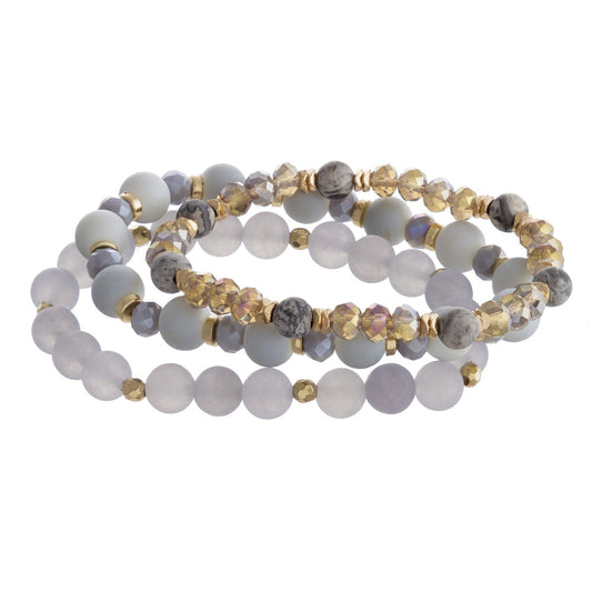 Breaded bracelet set featuring three stretch bracelets with natural stone inspired bead details and gold accents.