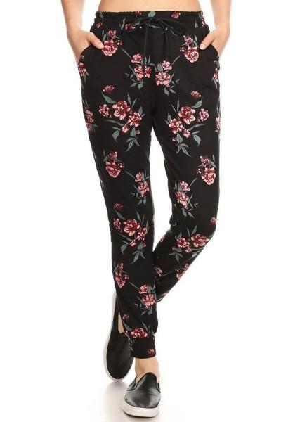 Floral print, full length, high waisted joggers sweatpants in a relaxed fit with an elastic waistband, drawstring ties, and side pockets
