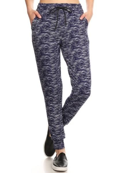 Multicolored abstract space dye print, full length, high waisted joggers sweatpants in a relaxed fit with an elastic waistband, drawstring ties, and side pockets