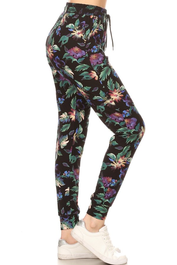 GREEN FLORAL printed joggers with solid trim, drawstring waistband, waist pockets, and cuffed hems