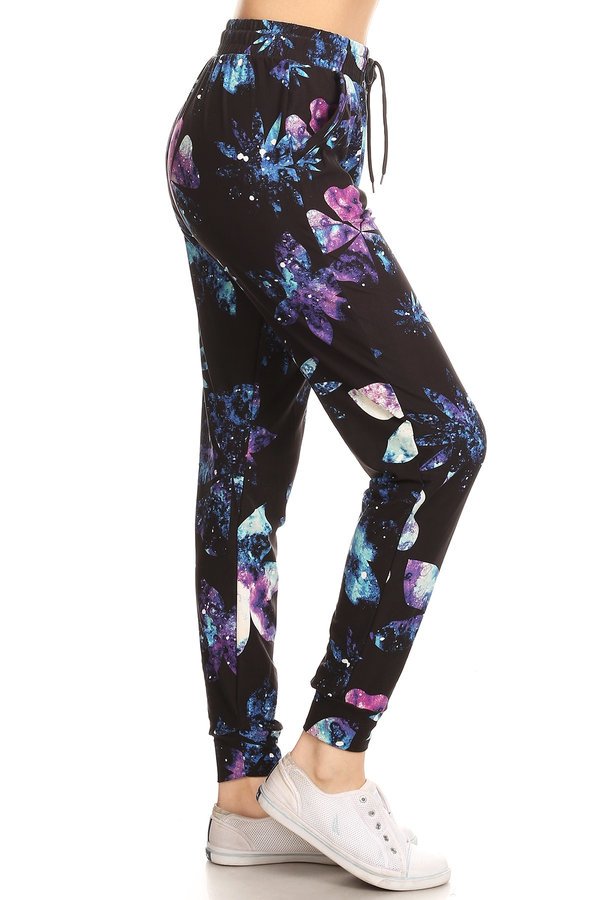 GALAXY FLORAL joggers with solid trim, drawstring waistband, waist pockets, and cuffed hems