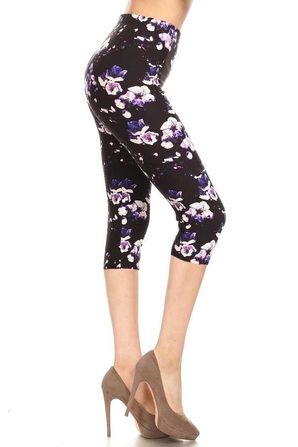 ONE SIZE high waisted capri leggings with an elastic band in a purple flower print over a black background