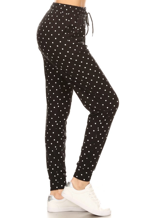 Polka dots printed joggers with solid trim, drawstring waistband, waist pockets, and cuffed hems