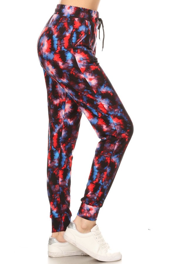 RED/BLUE TIE DYE printed joggers with solid trim, drawstring waistband, waist pockets, and cuffed hems