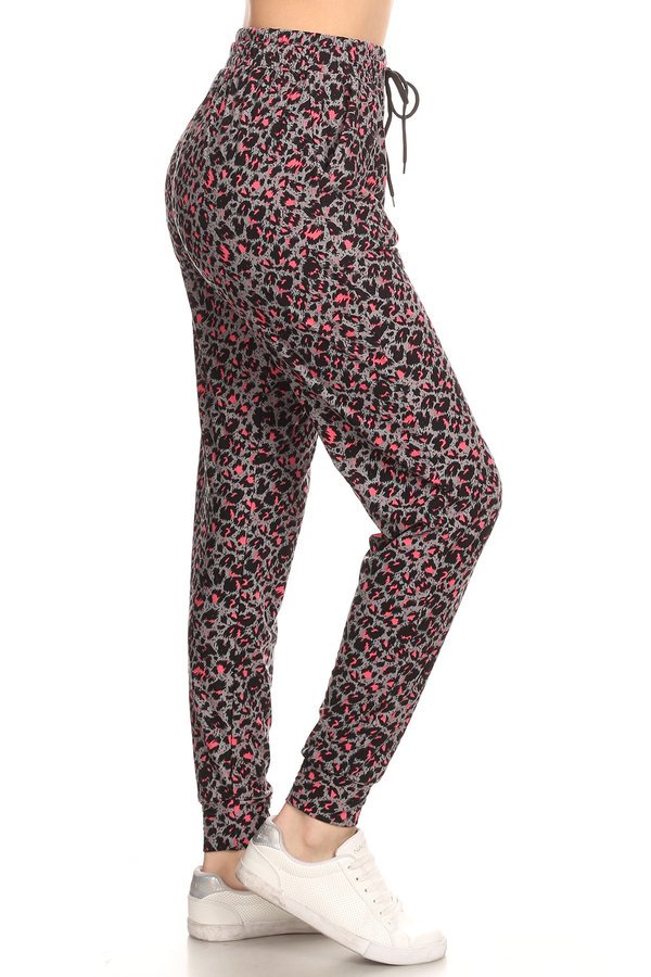 Leopard printed joggers with solid trim, drawstring waistband, waist pockets, and cuffed hems