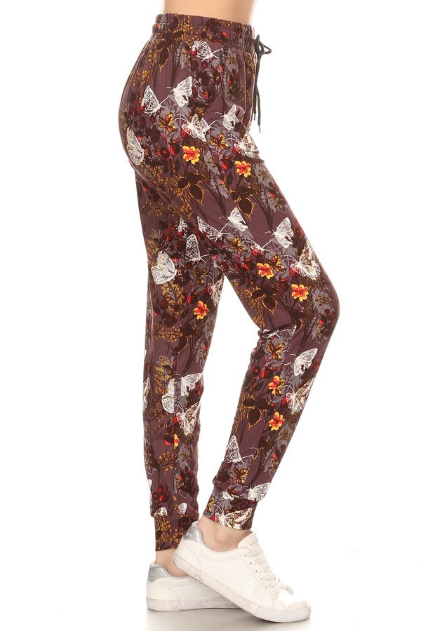 Butterfly printed joggers with solid trim accent, elastic waist with drawstring, waist pockets and cuffed hem