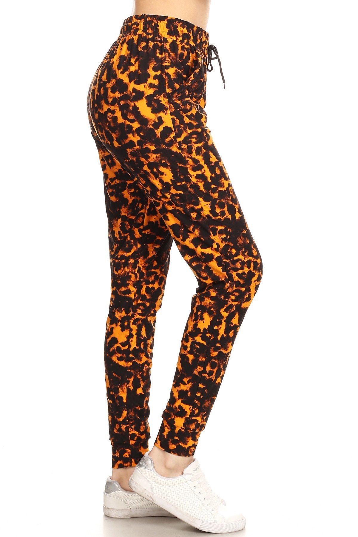 Leopard printed joggers with solid trim, drawstring waistband, waist pockets, and cuffed hems